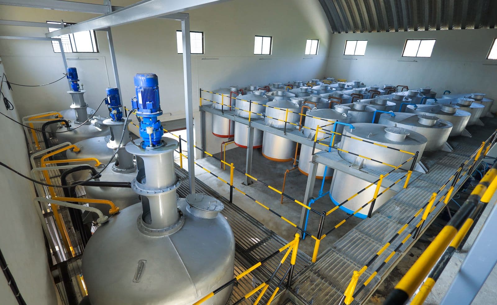 NISSANOL production floor with mixing tanks